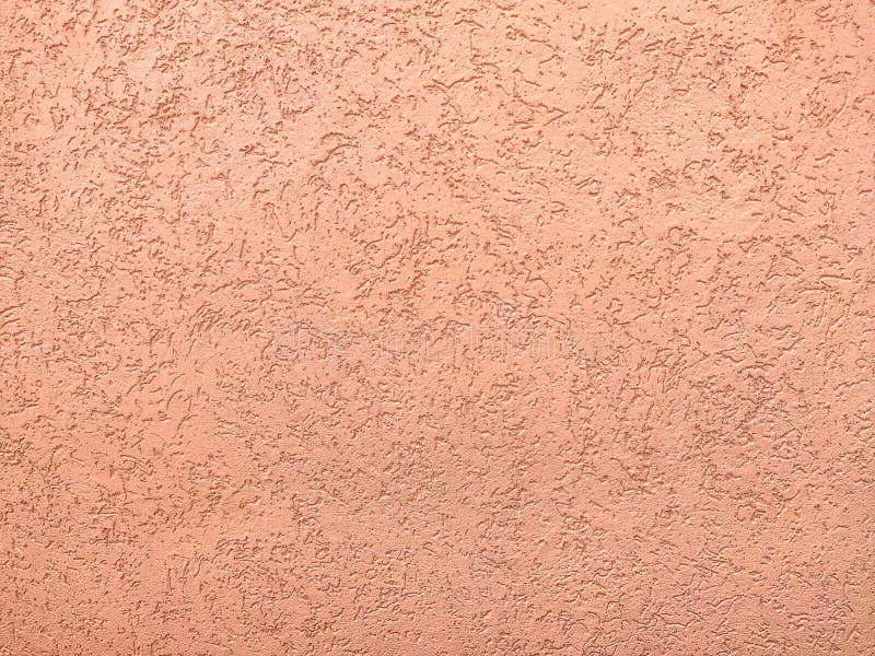 Texture of the pink plaster bark beetle on the wall. Seamless texture. The texture of the plaster is bark beetle on the wall. Seamless pink texture stock images